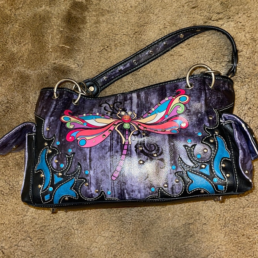 Black dragonfly purse with chains on the strap